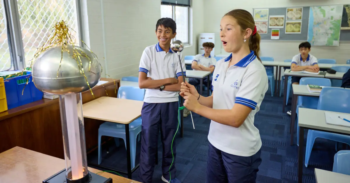 Happy students doing a scientific experiment at the international school of como